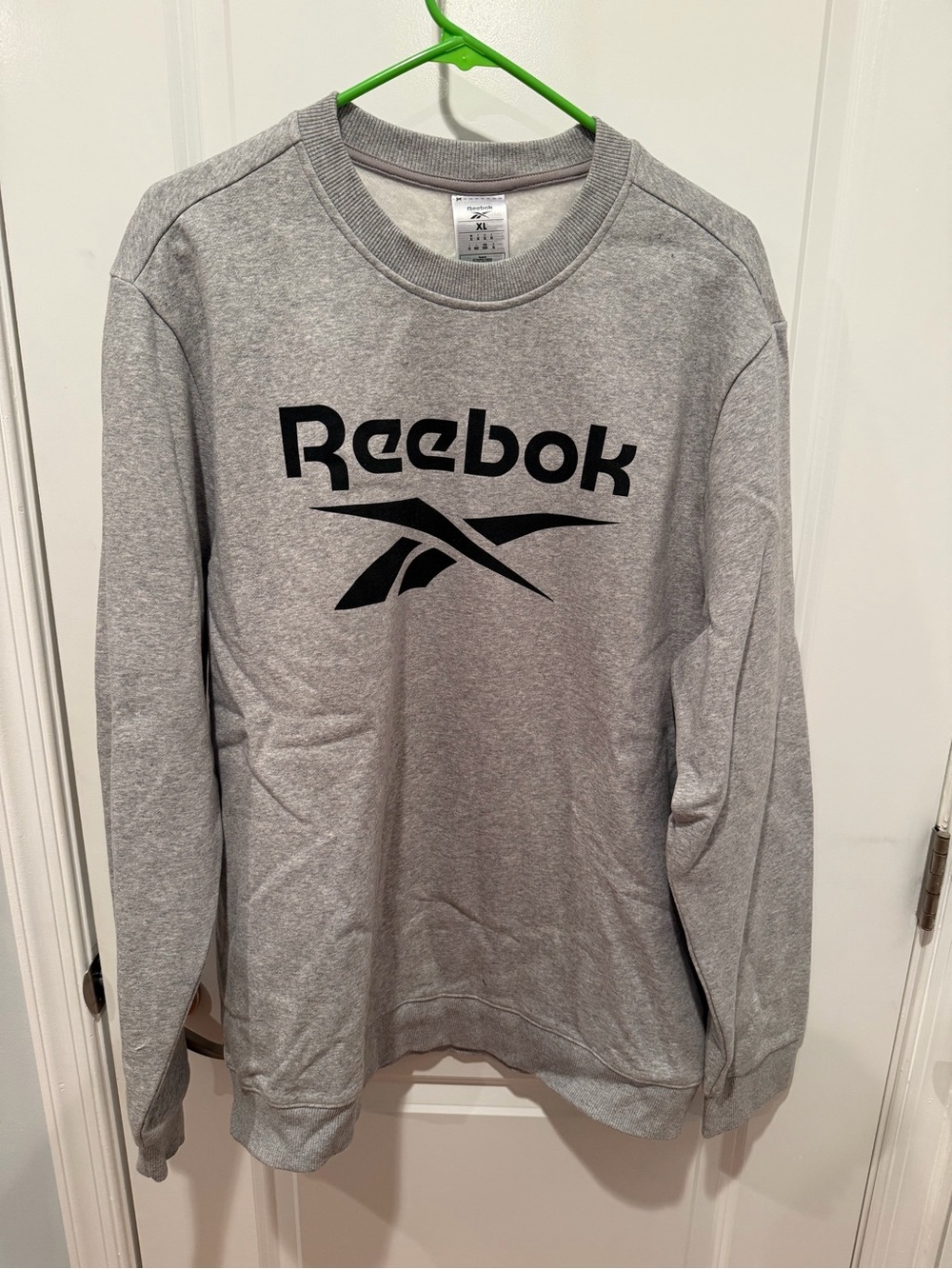 Reebok Gray Sweatshirt Tag Display with Black Logo
